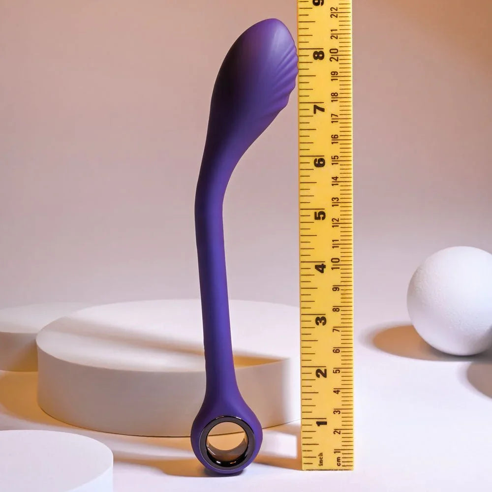 Purple Spot On vibrator standing against a ruler at about 9 inches
