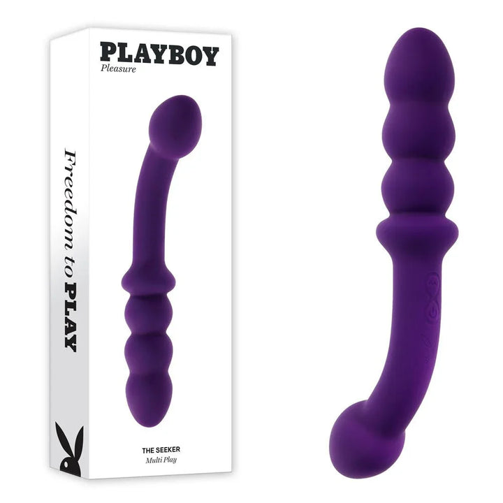 Playboy Pleasure The Seeker double ended vibrator in purple beside its retail box