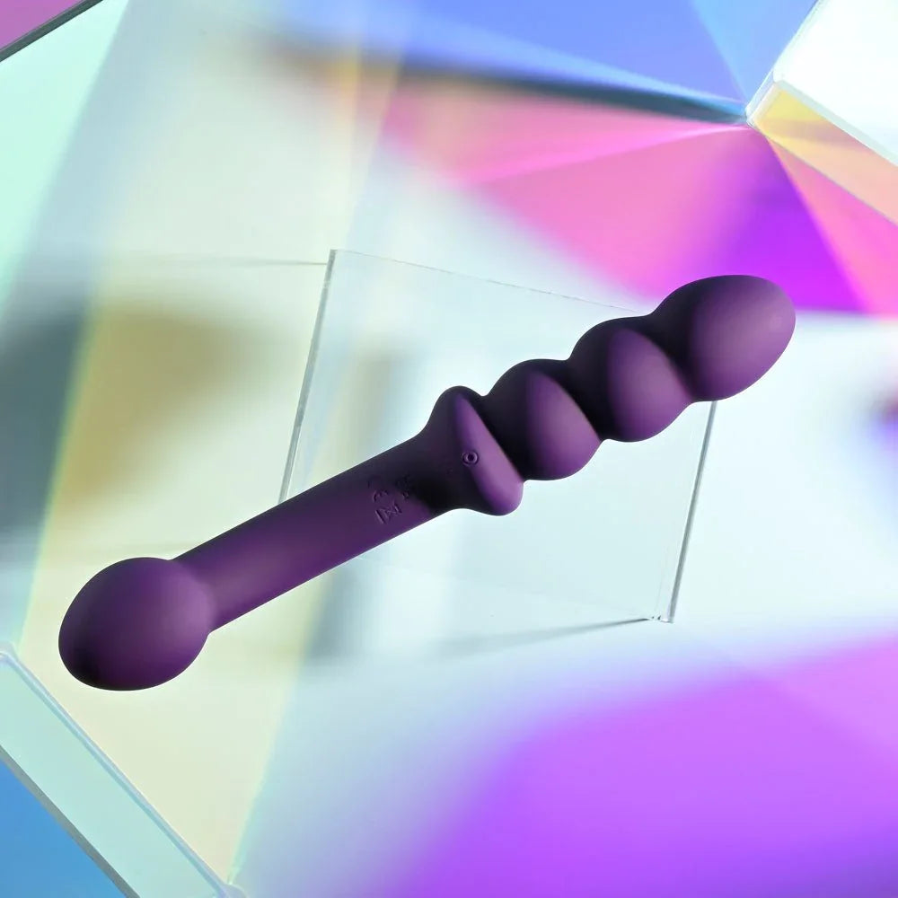 Purple Seeker shown full length on the diagonal, tapered tip through to the beads