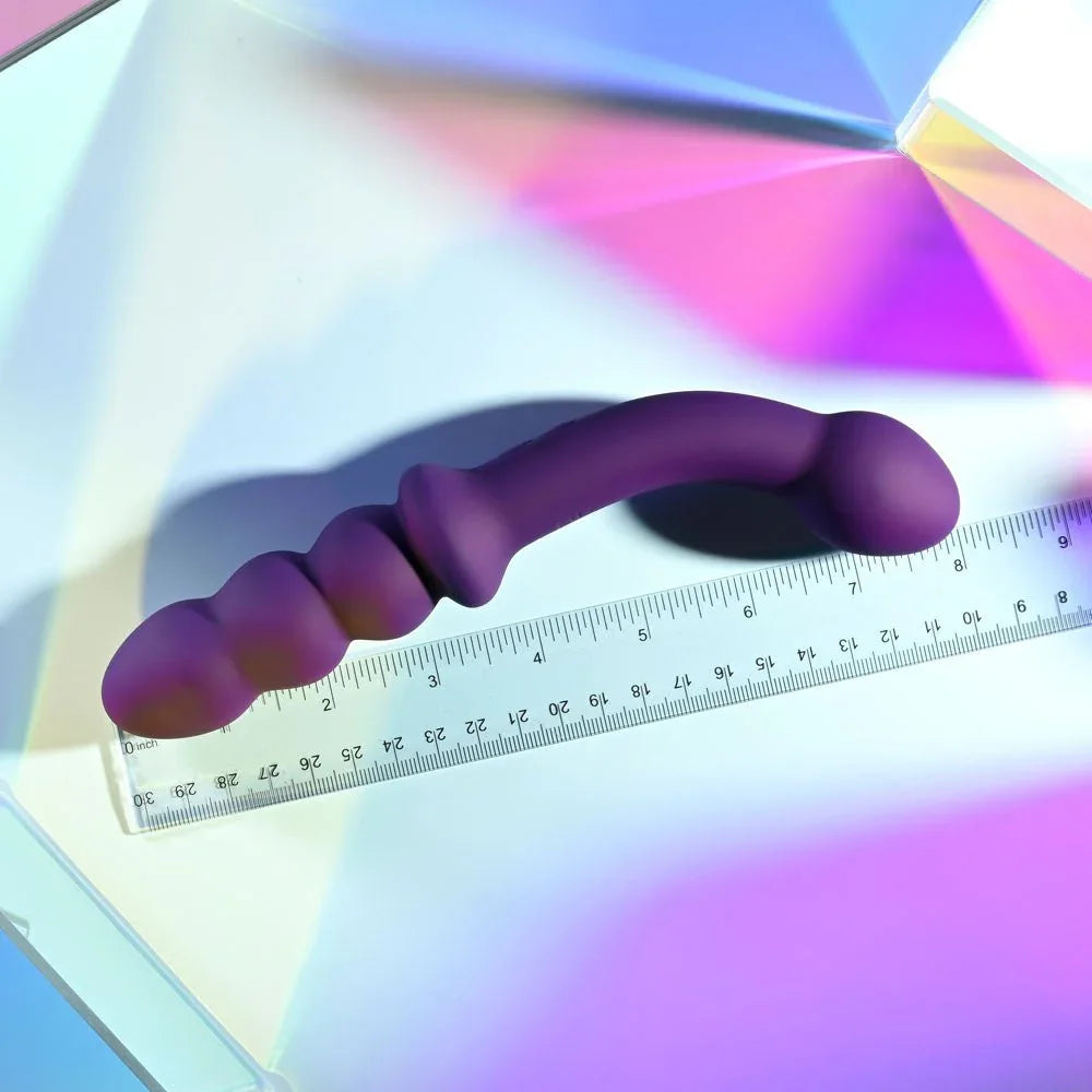 Purple Seeker laid along a ruler, measuring about 20 cm end to end