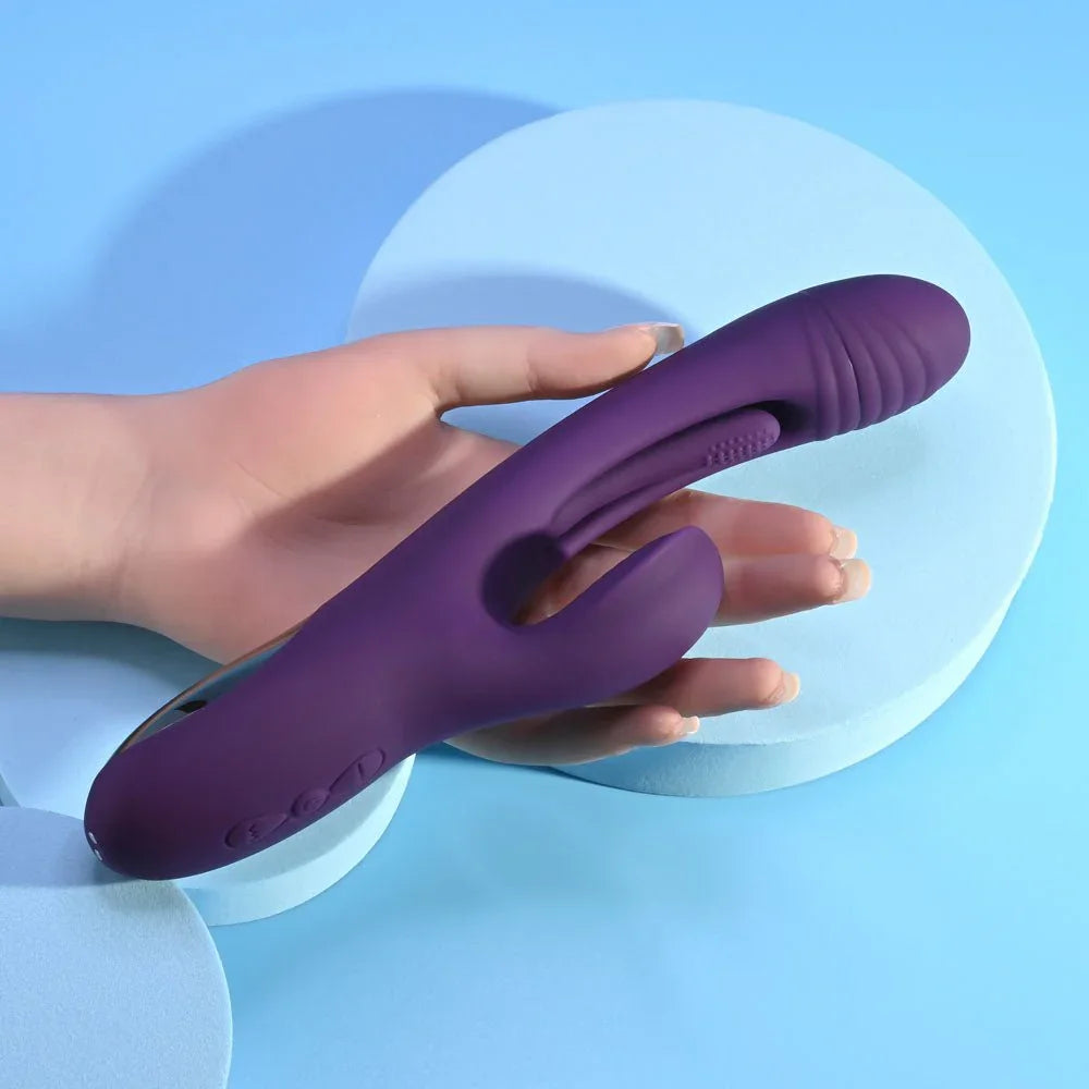 The Thrill rabbit vibrator held in a hand to show its 24 cm length