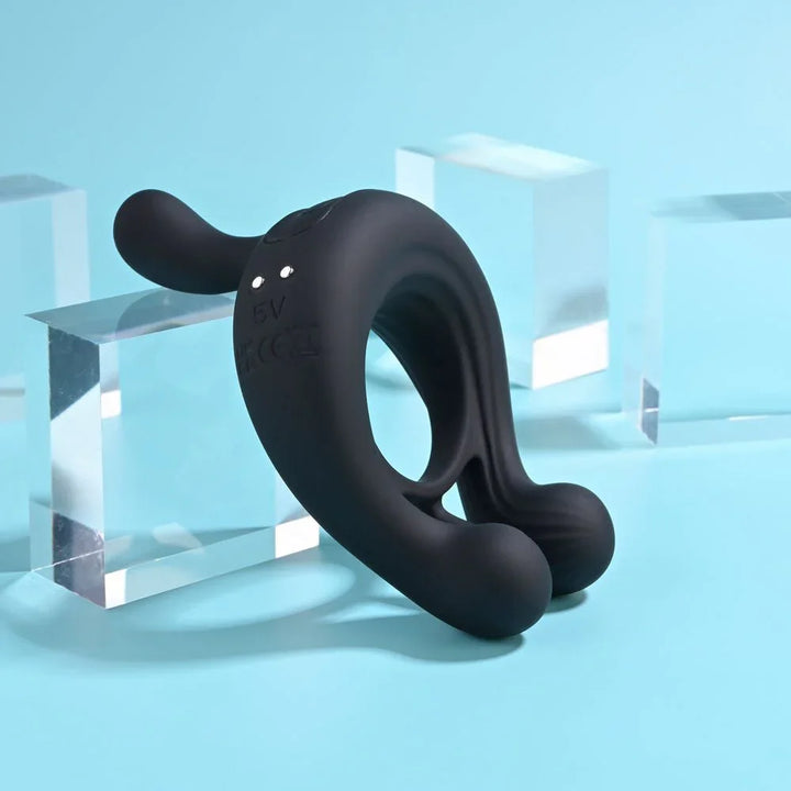 Black Triple Play ring angled to show the dual cock and ball loops and the raised tip