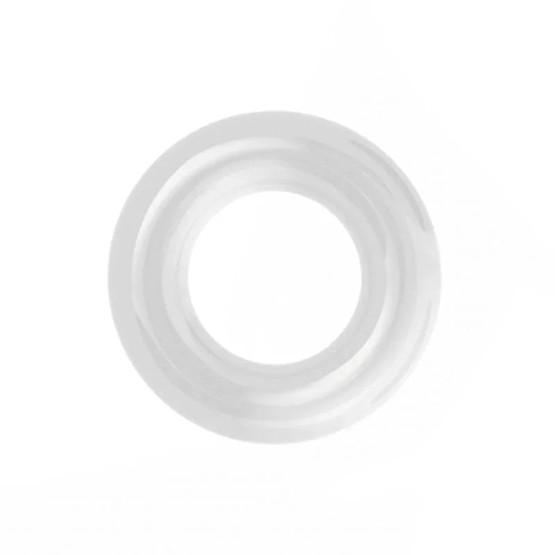 Clear donut cock ring on white, translucent and smooth