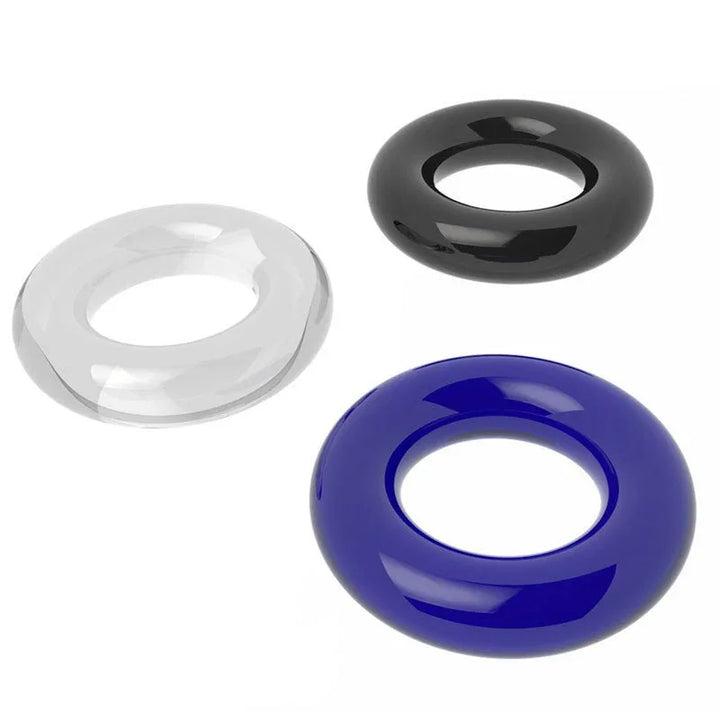 Clear, black and blue donut rings arranged together on white