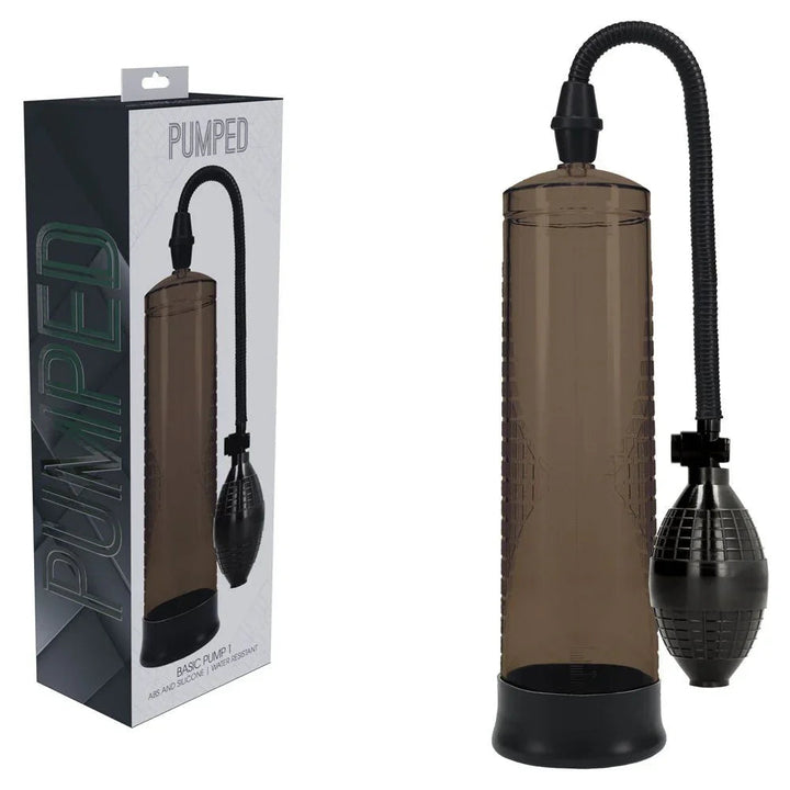 PUMPED Basic Penis Pump 1 in Black, dark retail box beside the smoke cylinder, hose and squeeze bulb