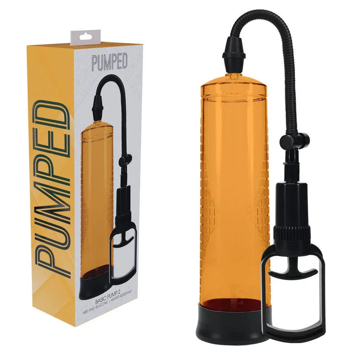 PUMPED Basic Penis Pump 2 in Orange, orange retail box beside the orange cylinder and trigger handle