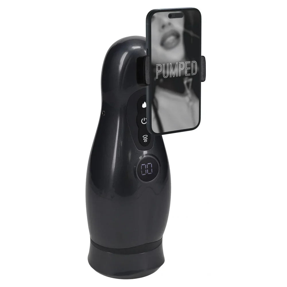 PUMPED Virtuo Auto Masturbator in Gunmetal, angled view with a phone clipped into the holder