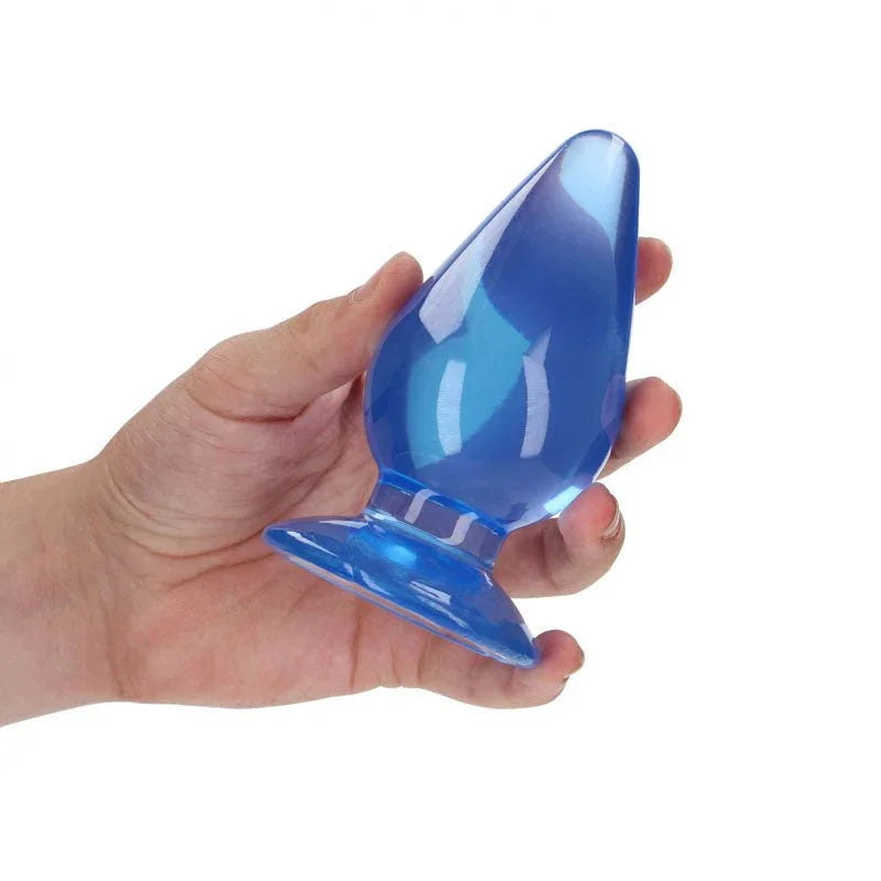 REALROCK 11.5 cm Anal Plug in Blue, held in one hand to show the plug's width