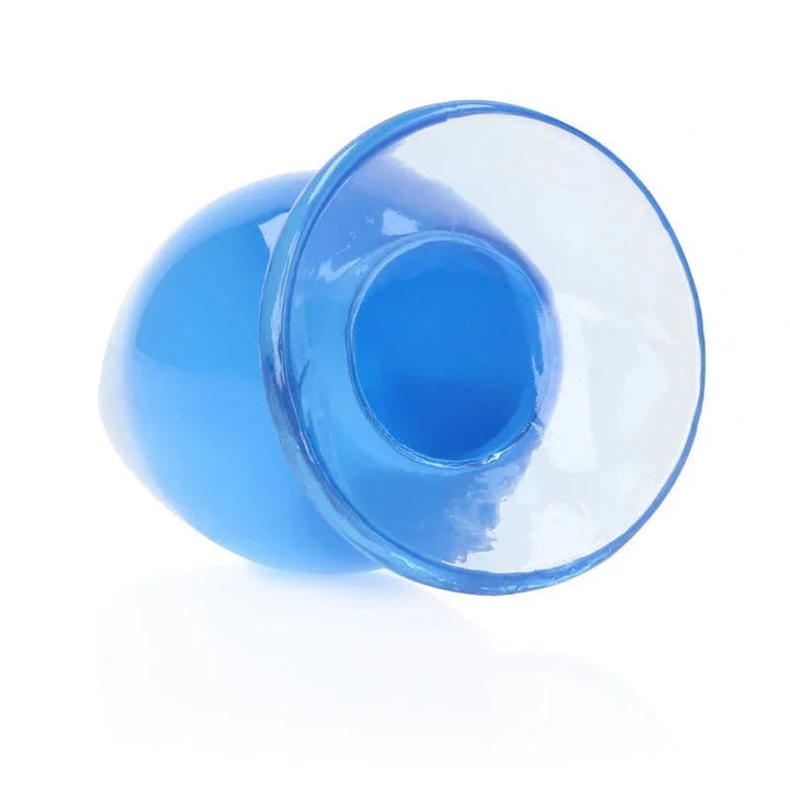 REALROCK 11.5 cm Anal Plug in Blue, tipped over so the flared base faces the camera