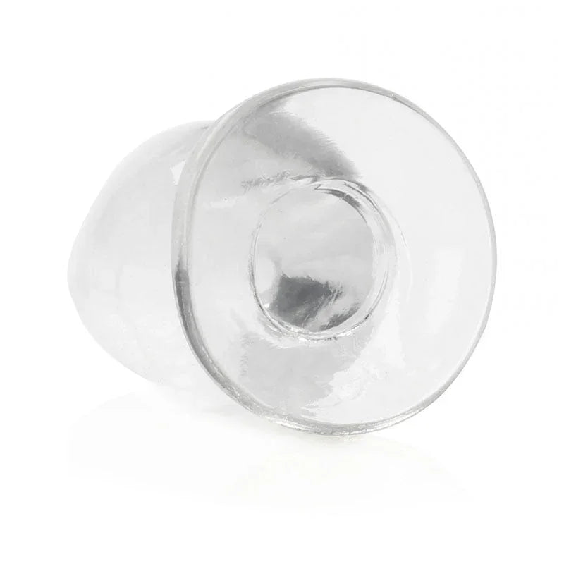 REALROCK 11.5 cm Anal Plug in Clear, tipped over so the flared base faces the camera