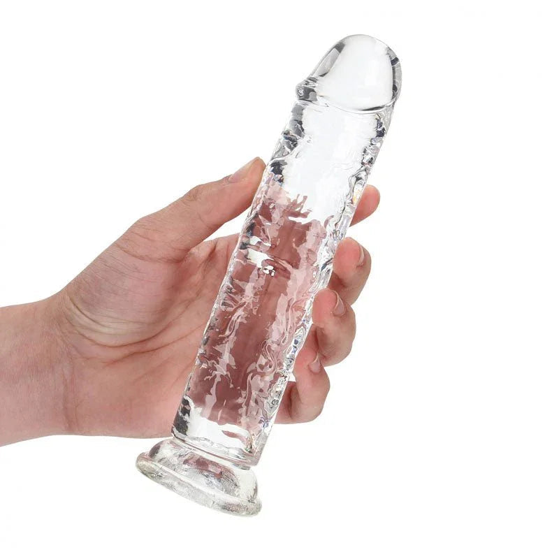 REALROCK 18 cm Straight Dildo in Clear, held in one hand to show its length