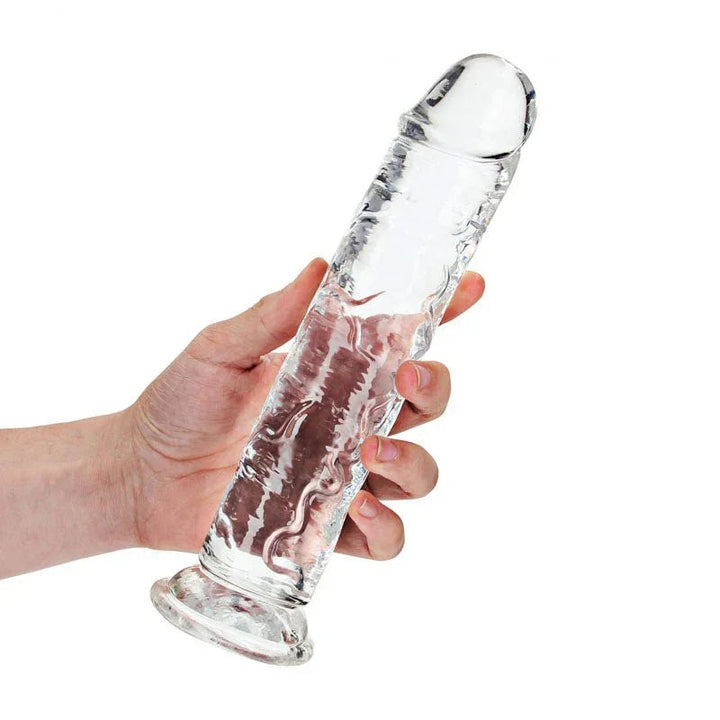 REALROCK 25 cm Straight Dildo in Clear, held in one hand to show its length