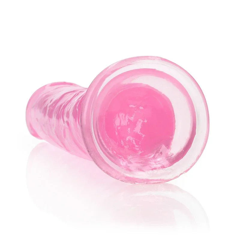 REALROCK 25 cm Straight Dildo in Pink, lying down with the suction base facing the camera