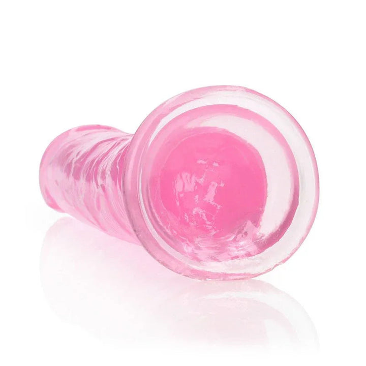 REALROCK 25 cm Straight Dildo in Pink, lying down with the suction base facing the camera