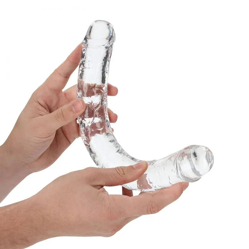 REALROCK 34 cm Double Dildo in Clear, flexed between two hands to show how far it bends