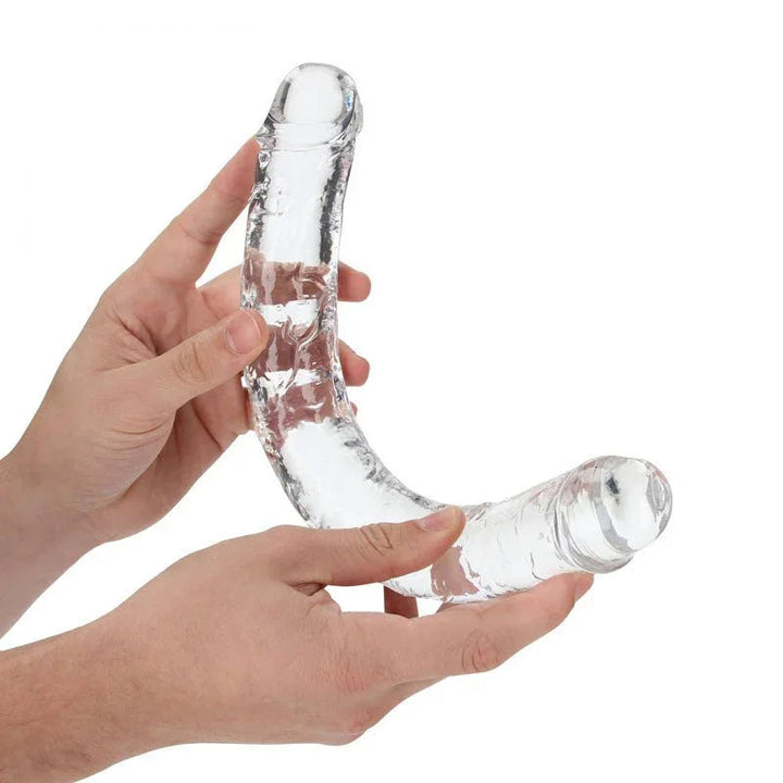 REALROCK 34 cm Double Dildo in Clear, flexed between two hands to show how far it bends