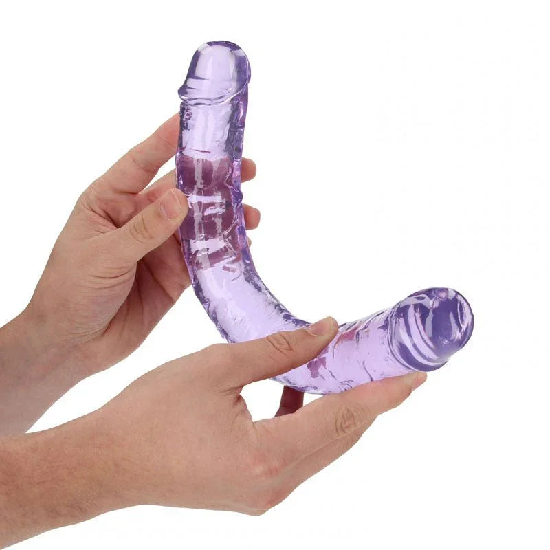 REALROCK 34 cm Double Dildo in Purple, flexed between two hands to show how far it bends