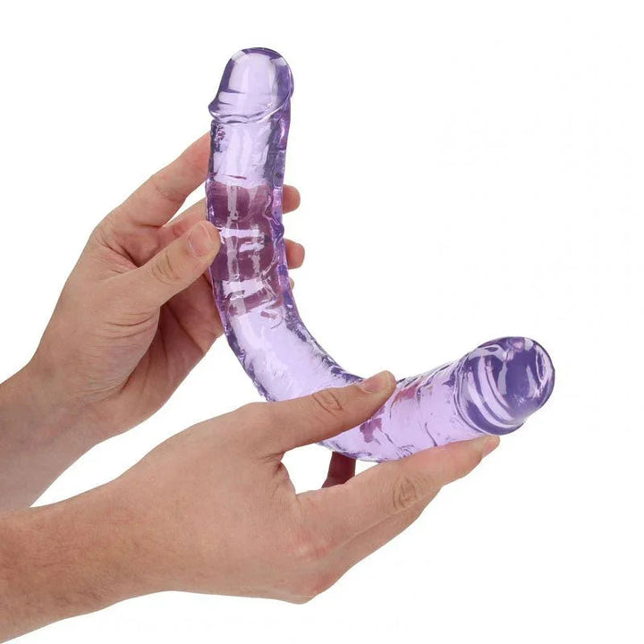 REALROCK 34 cm Double Dildo in Purple, flexed between two hands to show how far it bends