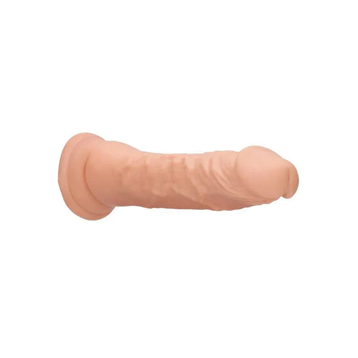 REALROCK 17.8 cm Realistic Dildo in Flesh, lying on its side showing the veined shaft