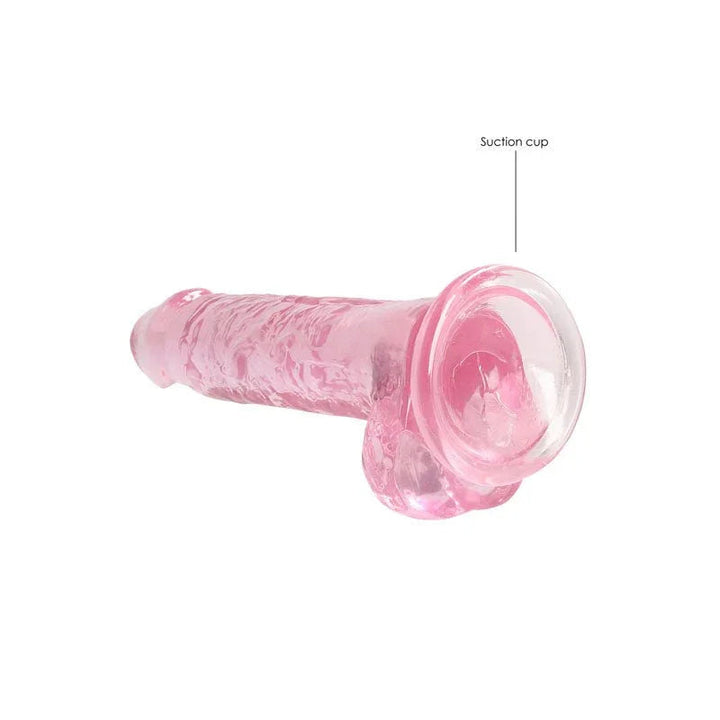 REALROCK 17.8 cm Realistic Dildo with Balls in Pink, lying flat with the suction cup labelled