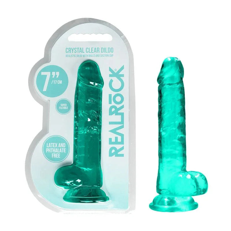 REALROCK 17.8 cm Realistic Dildo with Balls in Turquoise, blister pack beside the jelly-clear dildo