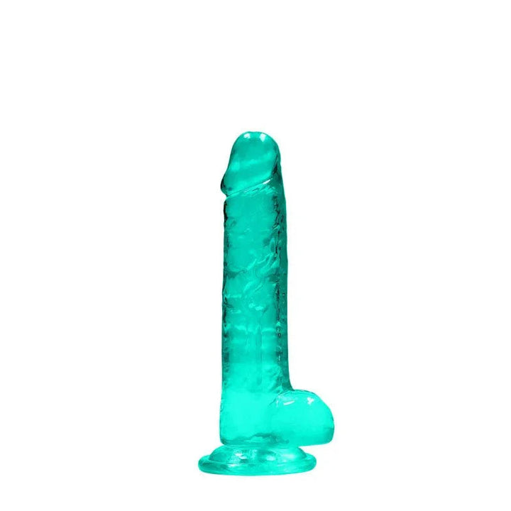 REALROCK 17.8 cm Realistic Dildo with Balls in Turquoise, standing upright on its suction base