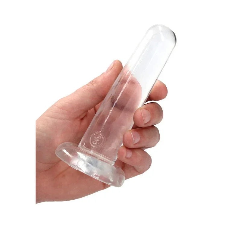 REALROCK 13.5 cm Non-Realistic Dildo in Clear, held in one hand to show its width