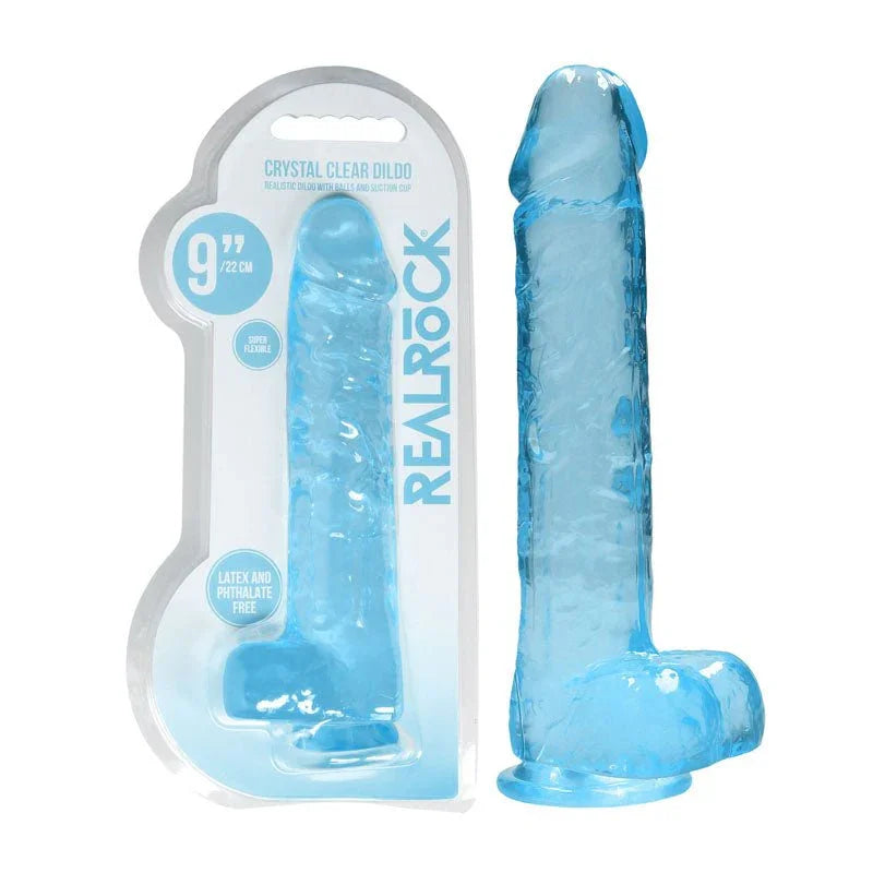 REALROCK 22.9 cm Realistic Dildo with Balls in Blue, blister pack beside the jelly-clear dildo
