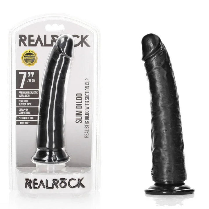 REALROCK 18 cm Realistic Slim Dildo in Black, blister pack beside the slim black dildo