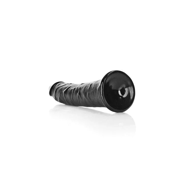 REALROCK 18 cm Realistic Slim Dildo in Black, lying down with the suction base facing the camera