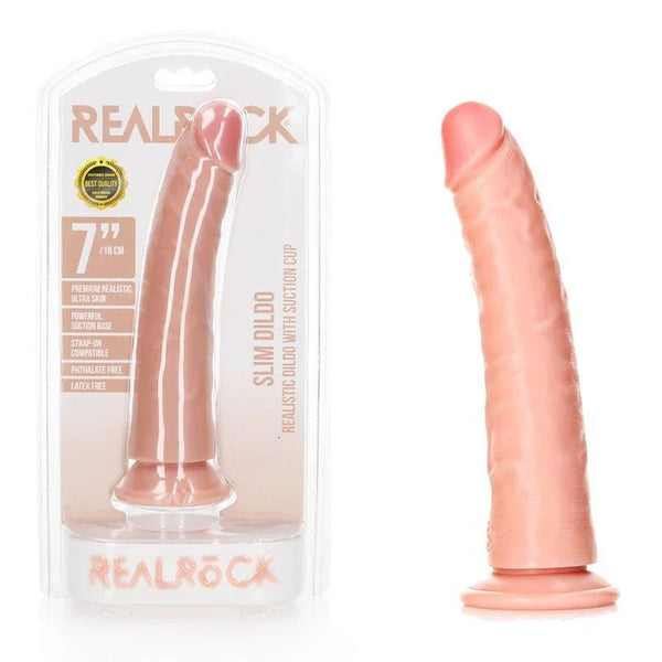 REALROCK 18 cm Realistic Slim Dildo in Flesh, blister pack beside the slim dildo on its suction base