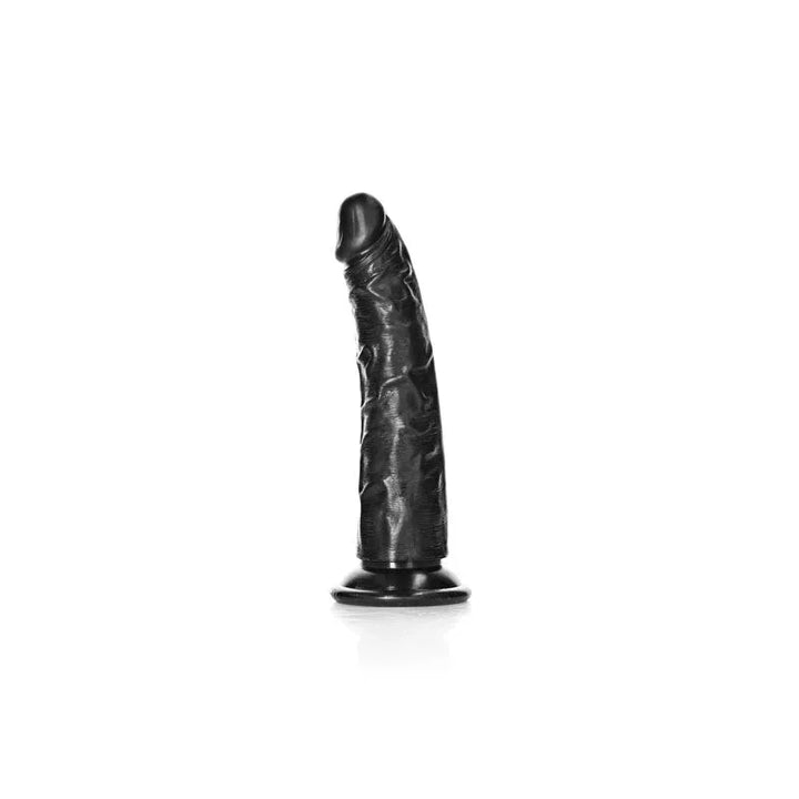 REALROCK 15.5 cm Realistic Slim Dildo in Black, side view standing on the suction base