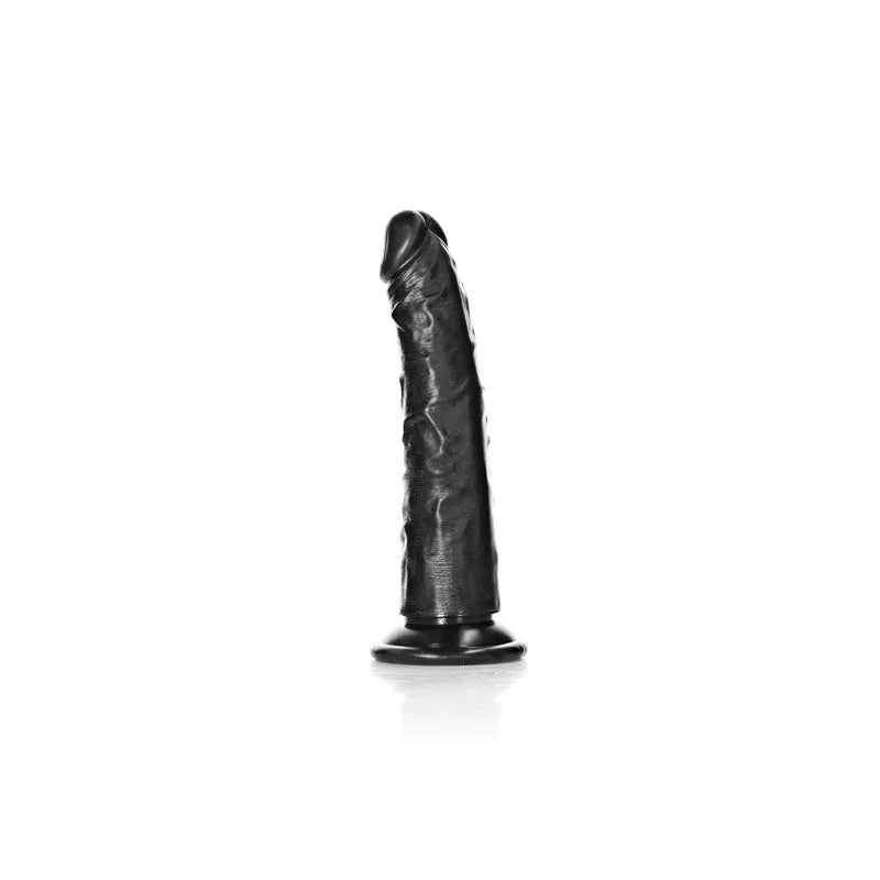 REALROCK 15.5 cm Realistic Slim Dildo in Black, three-quarter view standing on white