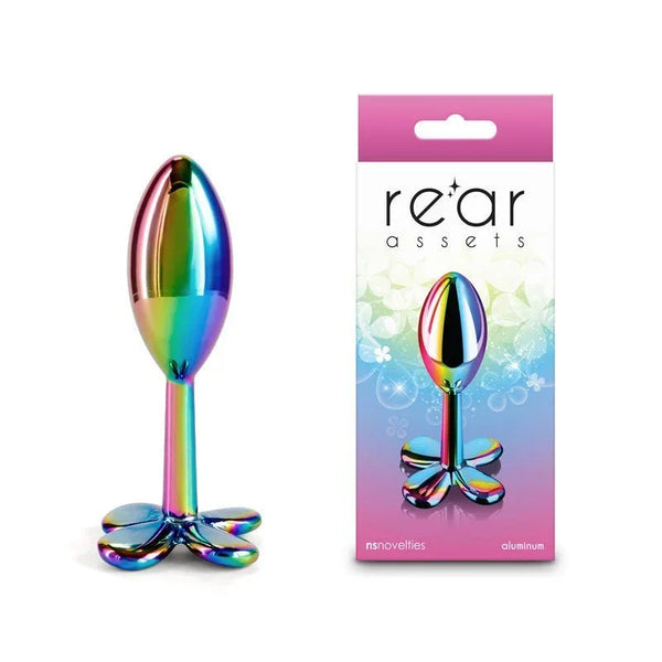 Rear Assets Clover metal butt plug in Multicolour, rainbow clover base, beside its box
