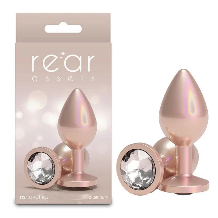 Rear Assets medium plug in Iridescent Champagne, upright and base-on, with its box