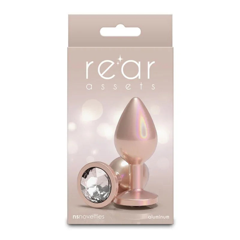 Rear Assets box in champagne, picturing the plug and its clear round gem base
