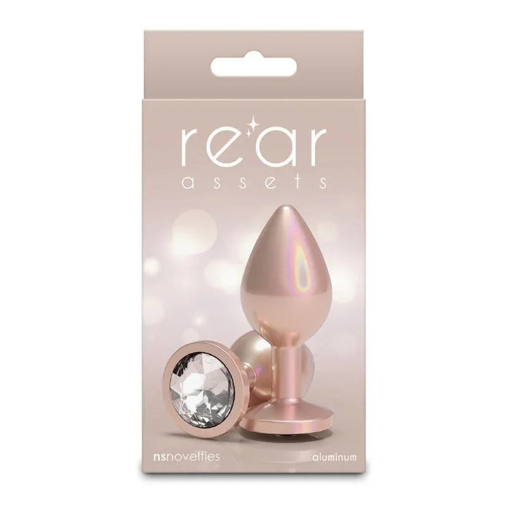 Rear Assets box in champagne, picturing the plug and its clear round gem base