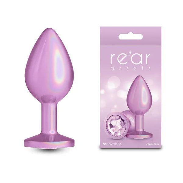 Rear Assets medium metal butt plug in Iridescent Pink, beside its pink Rear Assets box
