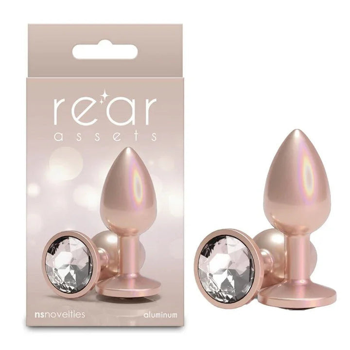 Rear Assets small plug in Iridescent Champagne, upright and base-on, with its box