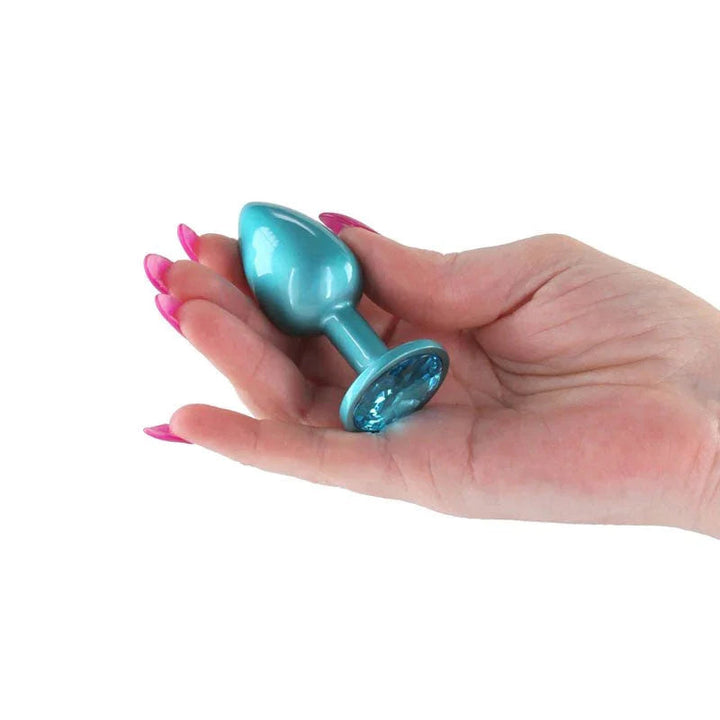 Rear Assets small plug in Iridescent Teal held in a hand, blue gem base showing