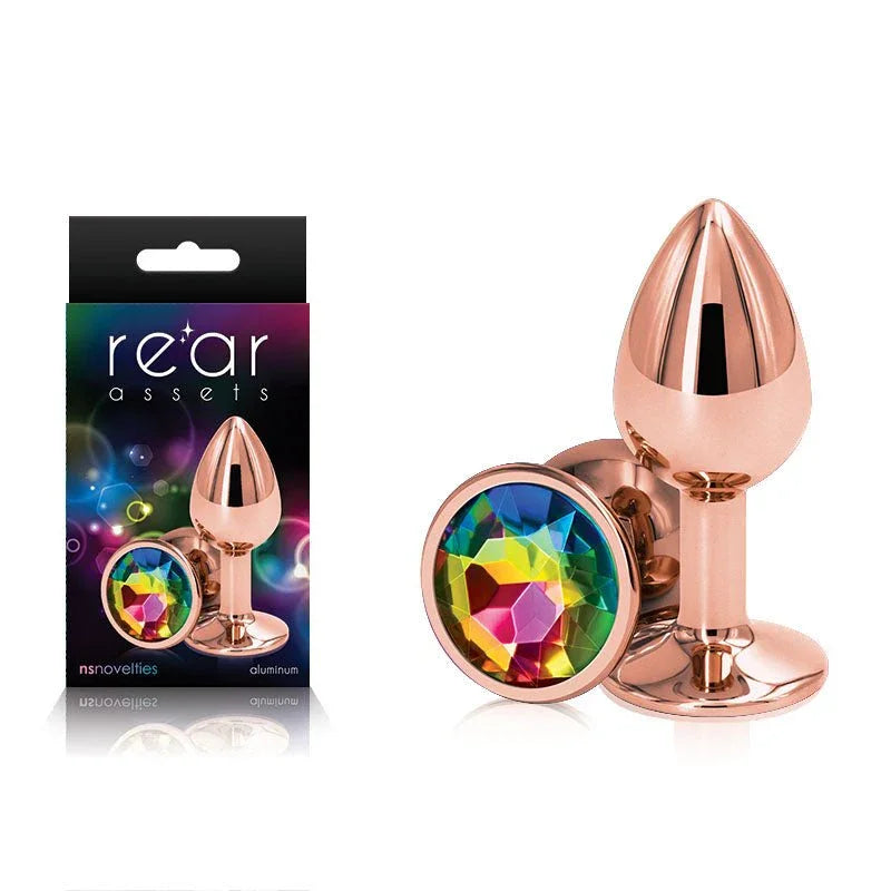 Rear Assets small metal butt plug in Rose Gold with a rainbow round gem base, and its box