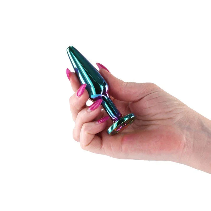 Rear Assets Tapered medium plug in Multicolour held in a hand, iridegent finish showing
