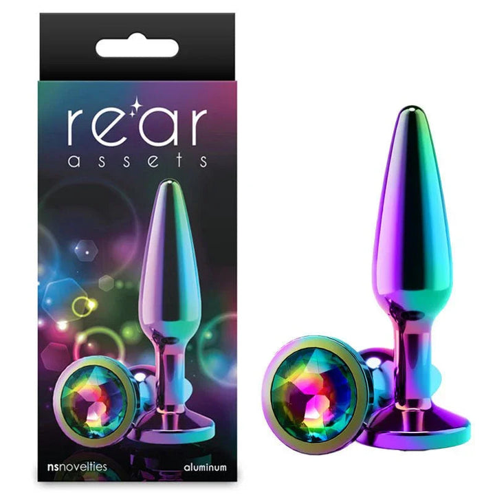 Rear Assets Tapered medium plug in Multicolour with a rainbow gem base, beside its box