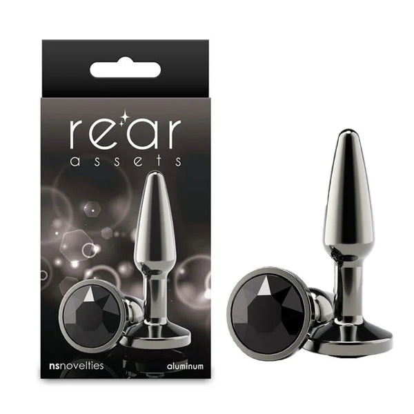 Rear Assets Tapered small plug in Gunmetal with a black gem base, beside its box