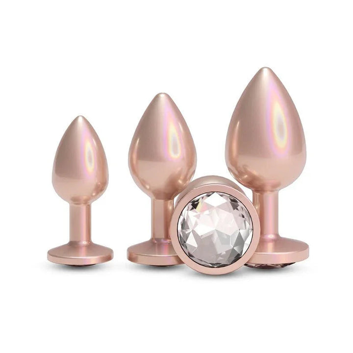 Rear Assets Trainer Kit in Iridescent Champagne, three plugs and the clear gem base