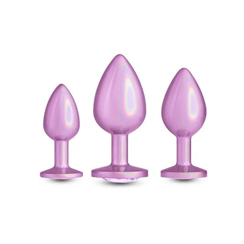 Rear Assets Trainer Kit in Iridescent Pink, three graduating plugs upright on white