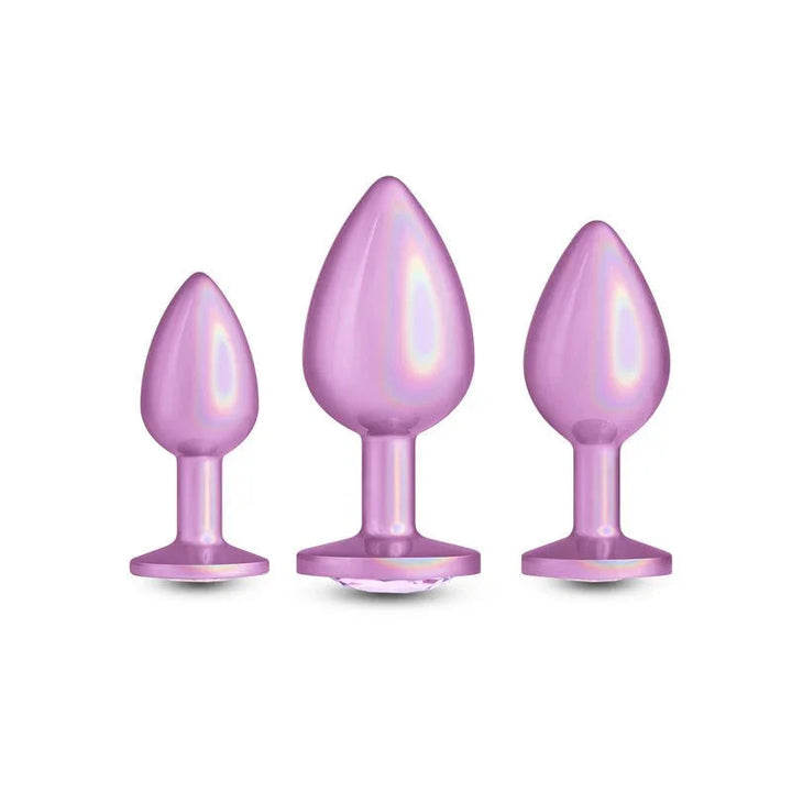 Rear Assets Trainer Kit in Iridescent Pink, three graduating plugs upright on white