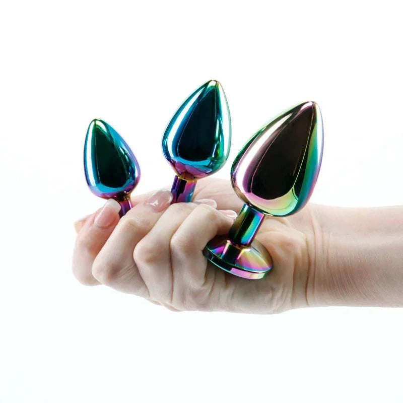 Rear Assets Trainer Kit in Multicolour, all three plugs held in a hand for scale