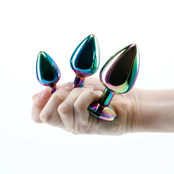Rear Assets Trainer Kit in Multicolour, all three plugs held in a hand for scale