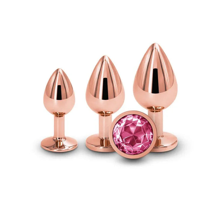 Rear Assets Trainer Kit in Rose Gold, three plugs upright with the pink gem base
